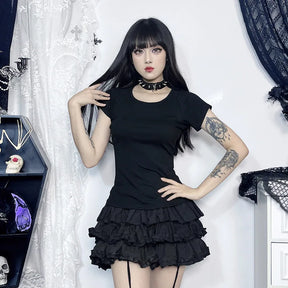 Front outfit view of the black angel T-shirt worn with a tiered skirt and choker, showing its plain front and short sleeves.