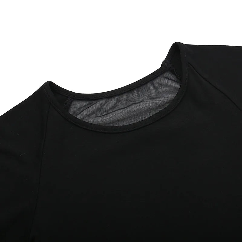 Close-up of the black T-shirt's round neckline, with the sheer back panel visible behind the opaque front.