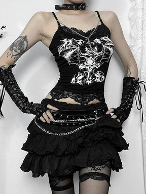 Gothic bat crop top styled with a black skirt, angled view