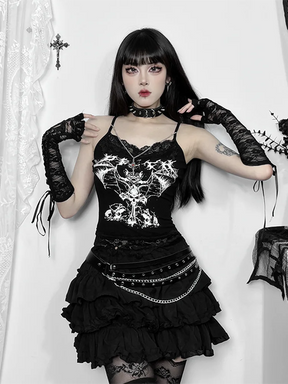 Full outfit view of bat lace camisole with model raising arms