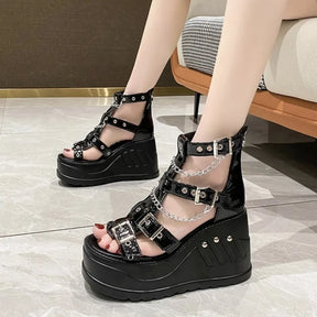 Side view of gothic wedge sandals showing buckles and studded platform