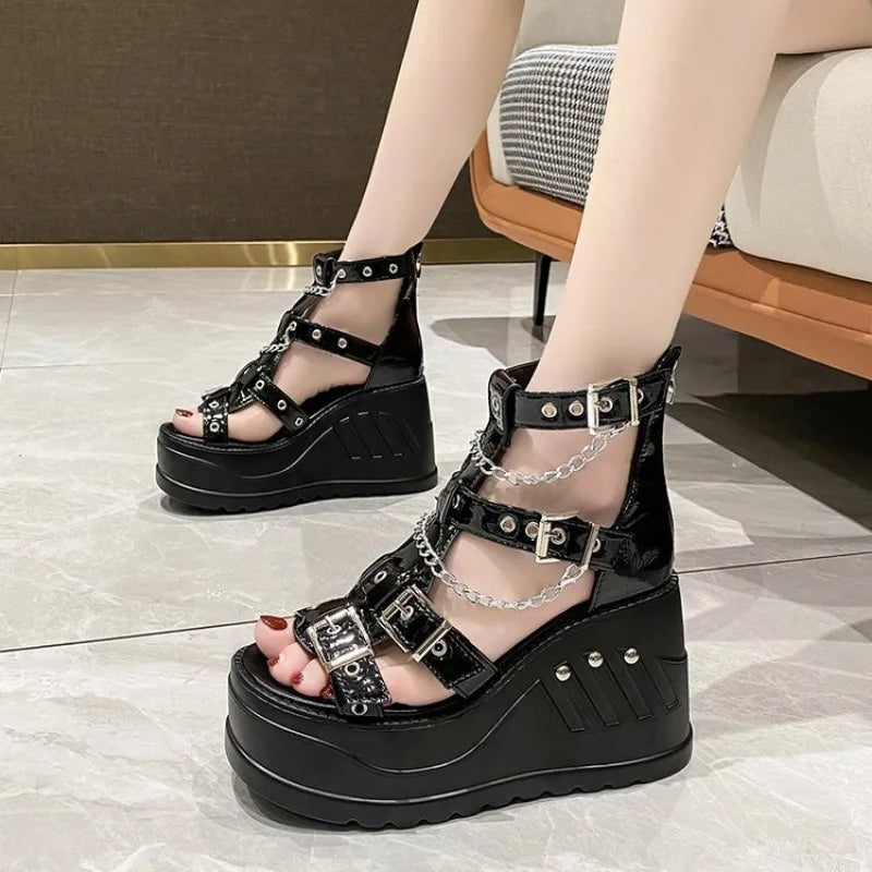 Side view of gothic wedge sandals showing buckles and studded platform