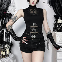 Gothic cross cutout buckle top styled with black shorts