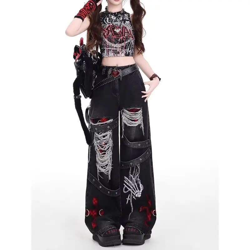 Front outfit view of high-waisted black punk jeans with distressed panels, red accents and a loose full-length cut.