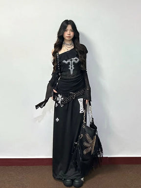 Front outfit view of black cross graphic top with flared sleeves