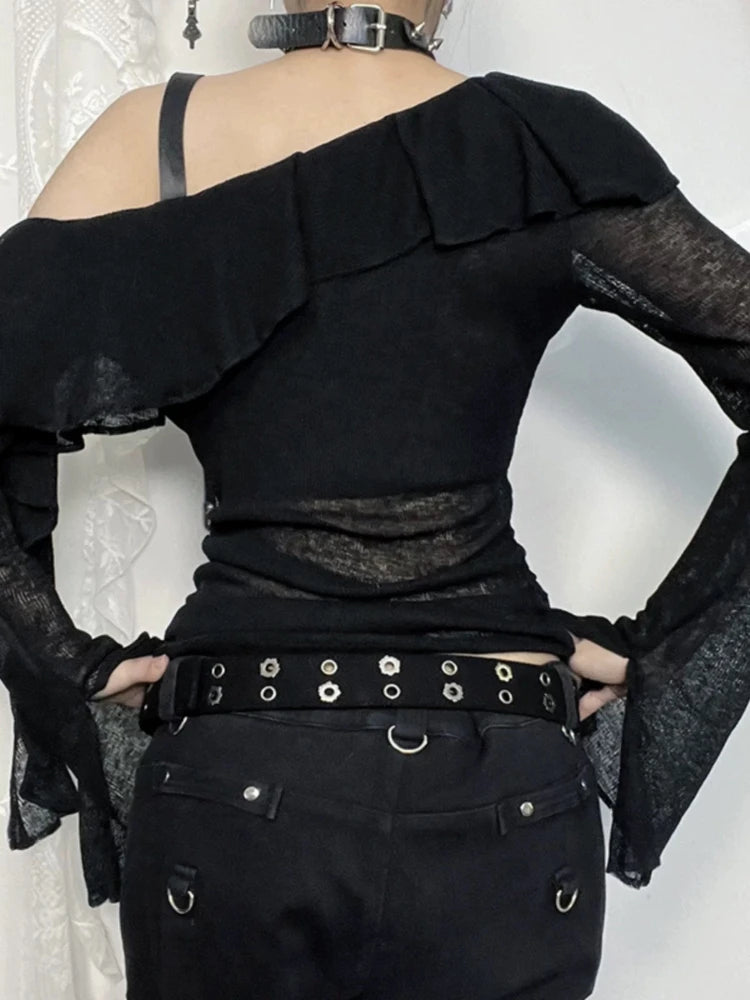 Back view of sheer black ruffle shoulder top with long sleeves