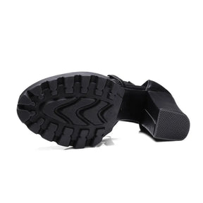Underside of gothic platform sandal showing deep sole grooves