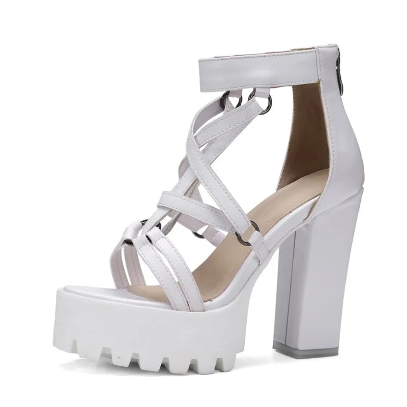 White gothic platform sandal showing ring-linked straps and block heel