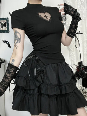 Black gothic T-shirt with a lace-bordered heart opening and central cross, worn at an angle with a tiered skirt.