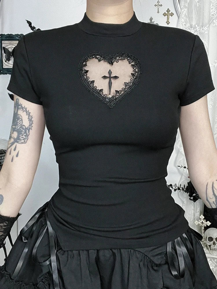 Front view of the black heart-cutout T-shirt with short sleeves, a close round neckline and a cross in the chest opening.