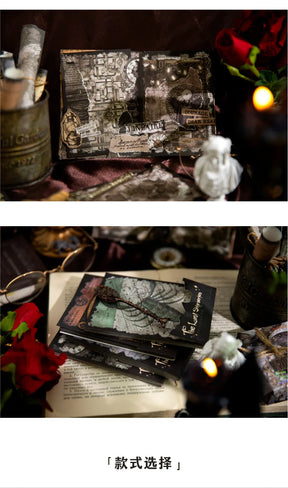 Finished gothic collage pages and a stack of decorative papers displayed in a dark tabletop arrangement.