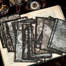 Monochrome gothic journaling paper fanned over an open book, with maps, clocks and dark illustrated borders.