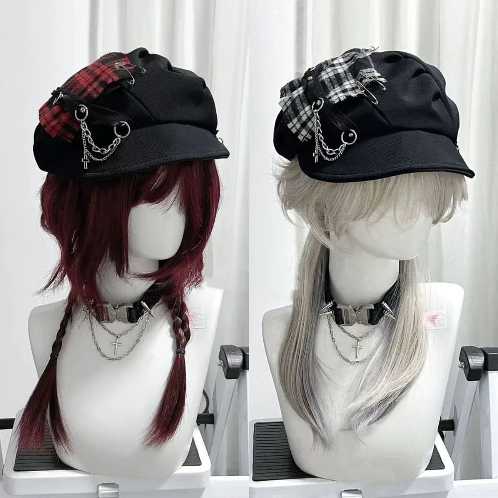 Red and monochrome plaid gothic newsboy caps displayed side by side with short brims, chains and cross charms.