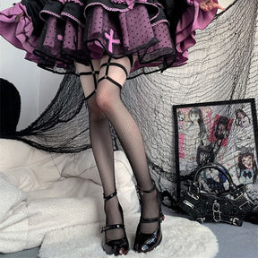 Full styled view of dark Mary Jane heels with patterned tights and a purple-and-black skirt. Red strap accents and clear rose heels add small flashes of color.
