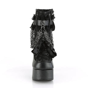 Straight-on front view of a black gothic platform boot with ribbon lacing, a bow and round toe.