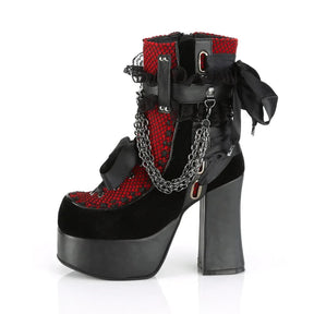 Red gothic ankle boot from a three-quarter angle, highlighting its lace panels, chain drapes and thick platform.