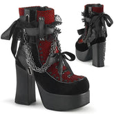 Red gothic platform ankle boots shown from front and back, with black bows, lace panels and draped chains.