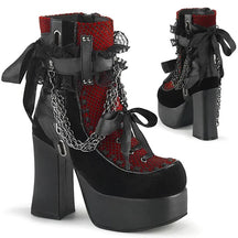 Red gothic platform ankle boots shown from front and back, with black bows, lace panels and draped chains.