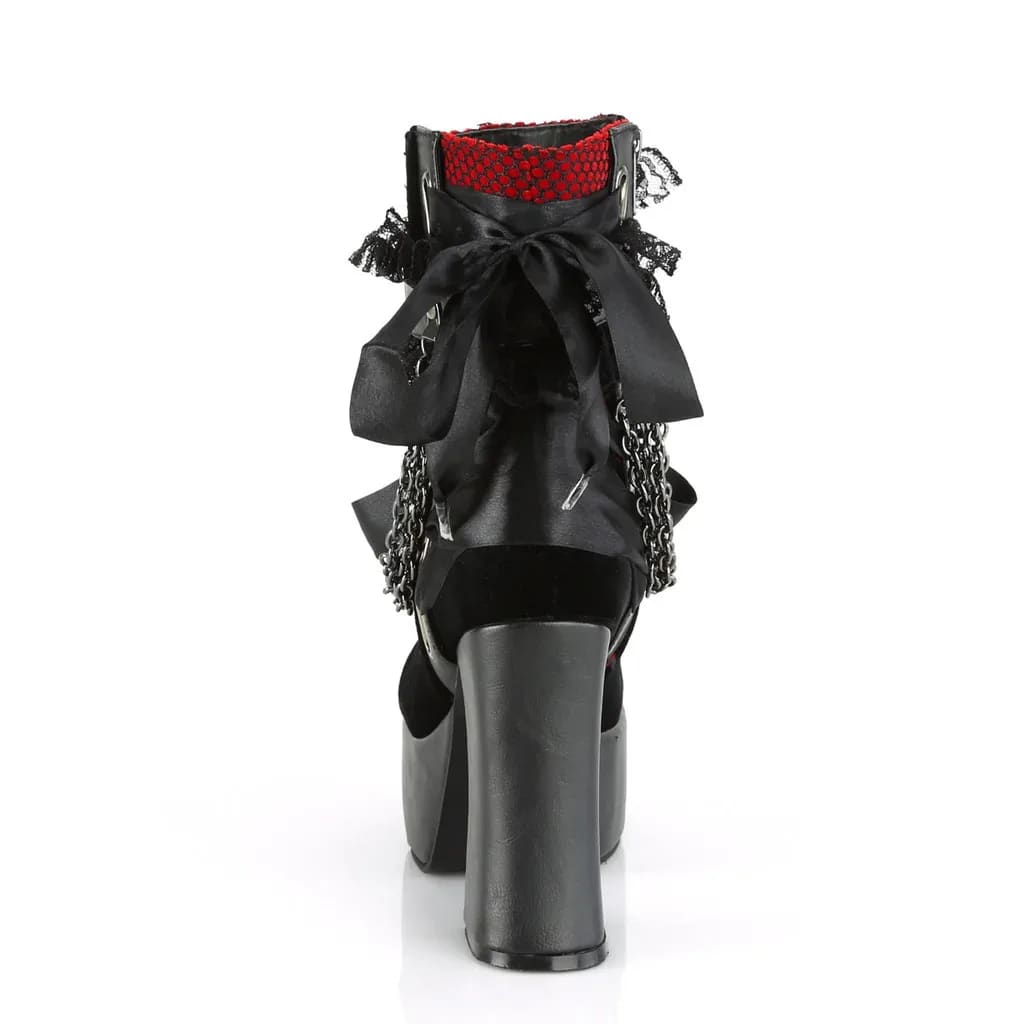 Rear view of a red gothic platform boot with a large black bow and red lace-trimmed cuff.