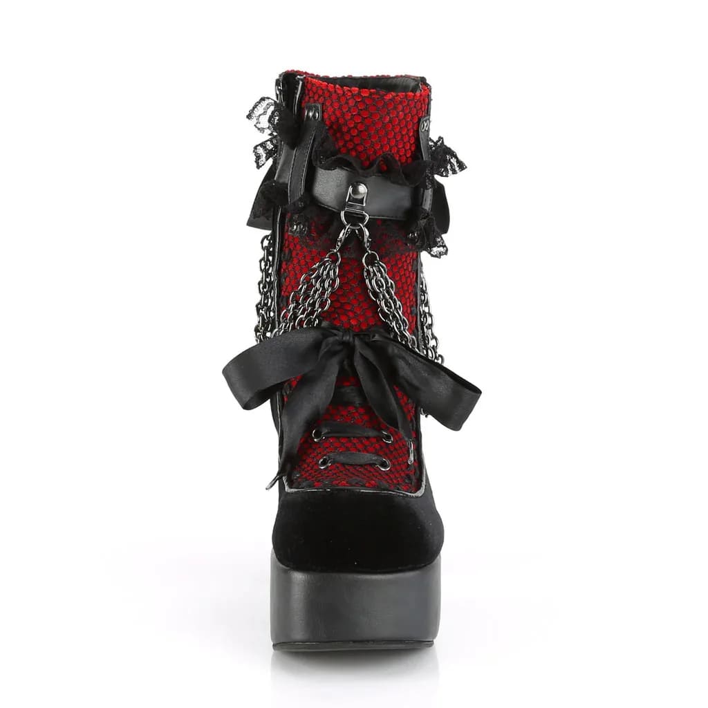 Front view of a red gothic platform boot showing black ribbon lacing, lace texture and a rounded toe.
