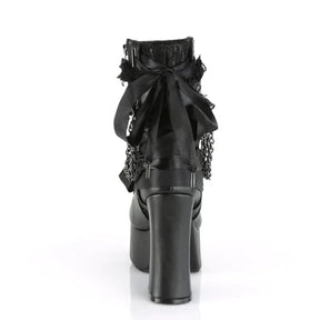 Rear view of a black gothic platform boot showing its large ribbon bow, lace cuff and block heel.