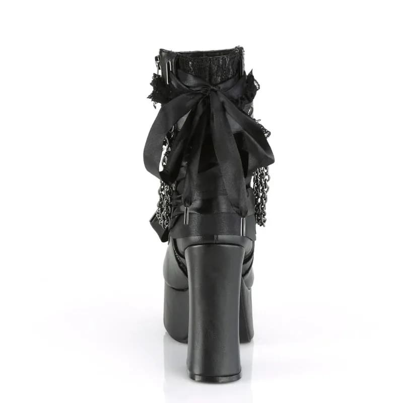 Rear view of a black gothic platform boot showing its large ribbon bow, lace cuff and block heel.