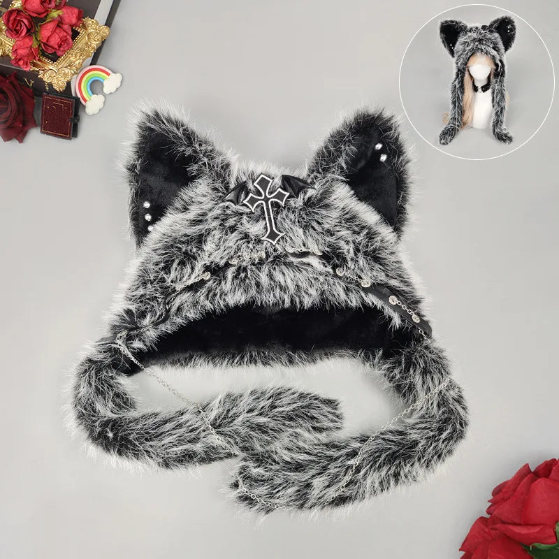 Gray shaggy cat ear hat with black inner ears, a bat-wing cross and long chain-trimmed flaps.