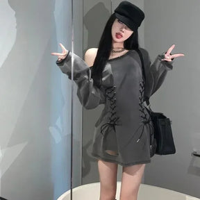 Gray lace-up mini dress styled with a dark hat, front view