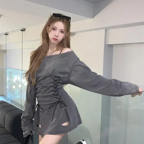 Side view of gray gothic mini dress showing loose long sleeves