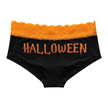Black briefs with orange Halloween lettering beneath a scalloped orange lace waistband.