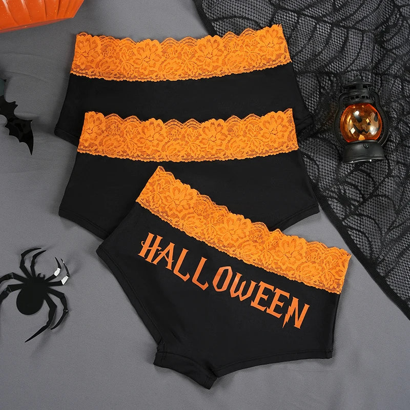 Orange lace briefs showing a plain black back beside the Halloween lettering option.