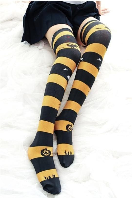 Black and yellow creepy cute thigh high stockings with pumpkin and graveyard designs for halloween fun