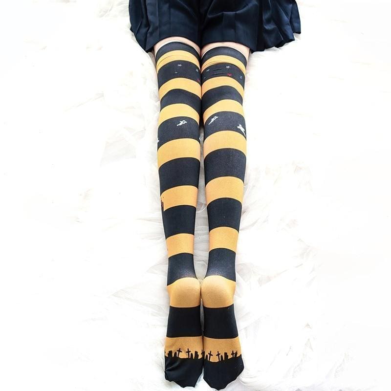 Halloween striped thigh high stockings in black and yellow with creepy cute white birds and graveyard toe design