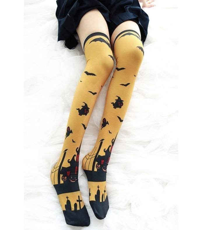 Yellow halloween striped thigh high stockings with creepy cute black bats witches and spooky castle designs