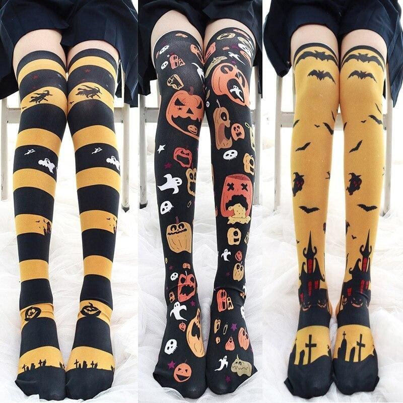 Three pairs of creepy cute halloween striped thigh high stockings with black yellow stripes pumpkins and bats design