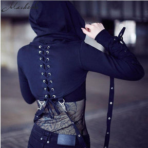 Rear view of the hooded crop shrug showing corset-style back lacing, silver-tone eyelets and straps beneath the curved cropped hem.