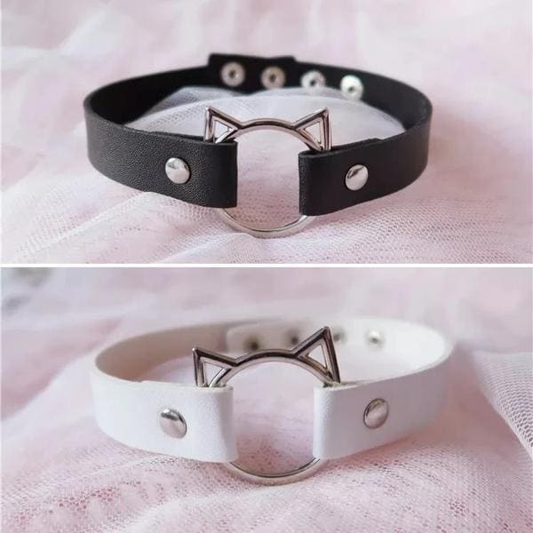 Black and white leather neko cat collar necklaces with silver cat ear clasps and central ring for edgy style