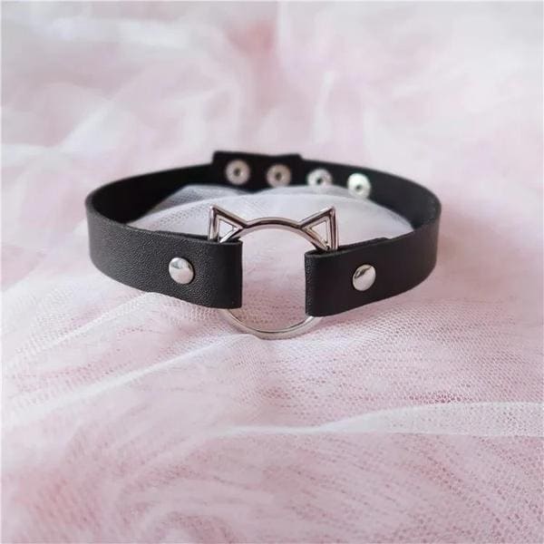 Black leather neko cat choker with silver cat-ear clasp and matching metal studs for edgy style