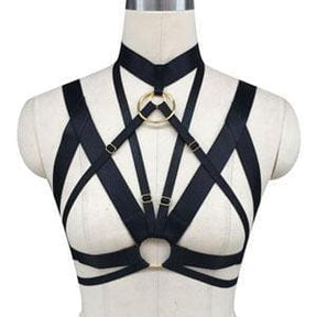 Black o ring chest harness with gold-toned metal accents and strappy design for bold chest harness looks