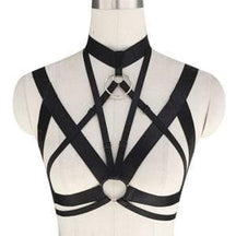 Black leather o-ring chest harness top with crisscross straps and central circular buckle