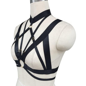 Black satin o ring chest harness with gold-toned metal buckles and rings for edgy fashion looks