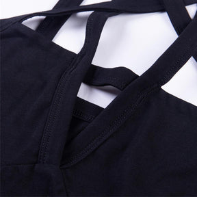 Close-up of the black bodysuit’s crossing straps and neat stitched edges, with open spaces between the pentagram bands.