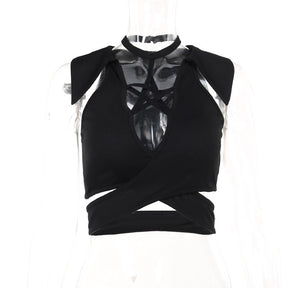 Black pentagram crop top on a clear mannequin, showing the connected neck strap, pointed collar accents and crossing waist panels.