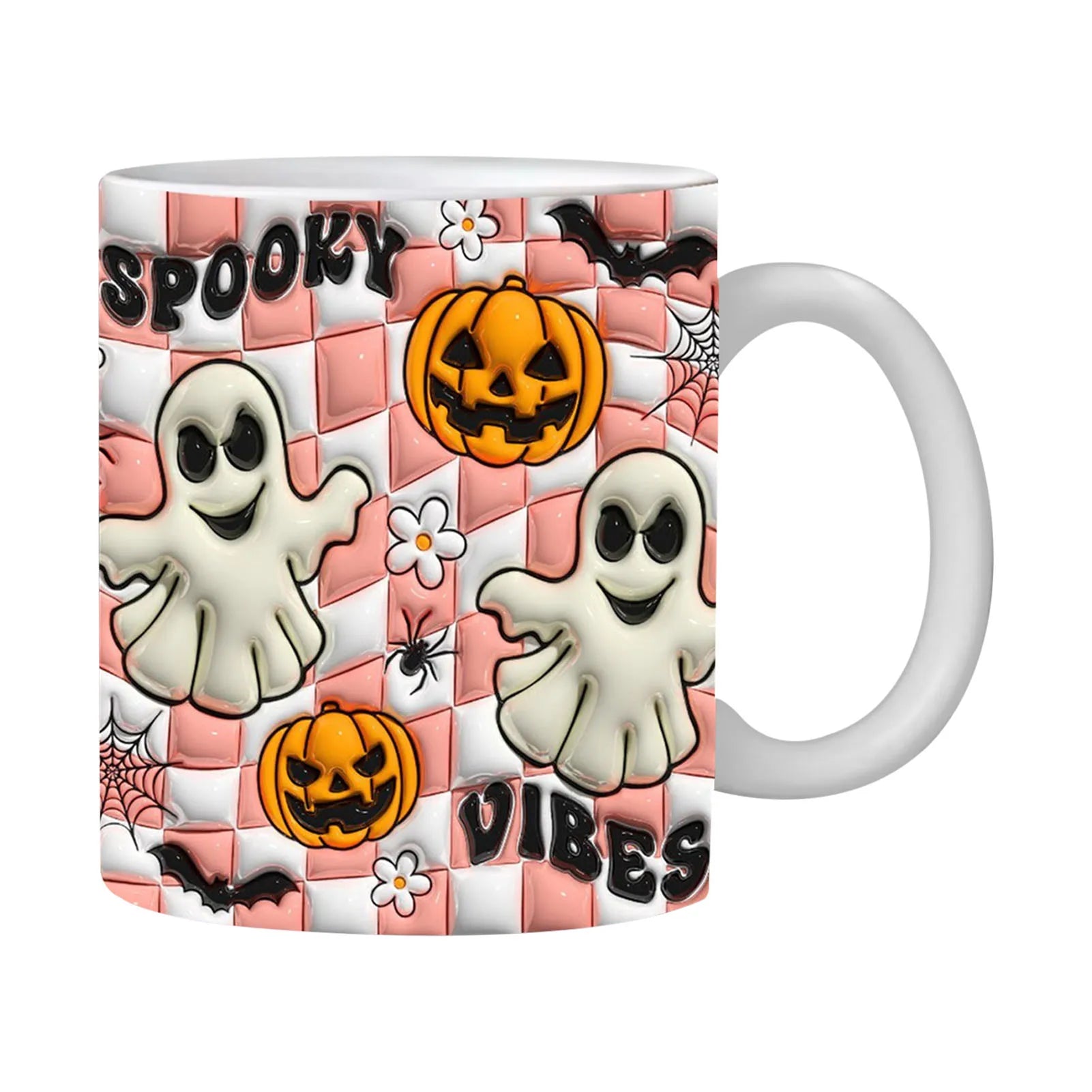 Pink checkerboard Spooky Vibes mug with pale ghosts, orange jack-o-lanterns and small flowers beside a white handle.