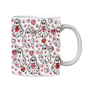 White mug covered in small ghosts carrying pink hearts, with pink and red heart details between them.