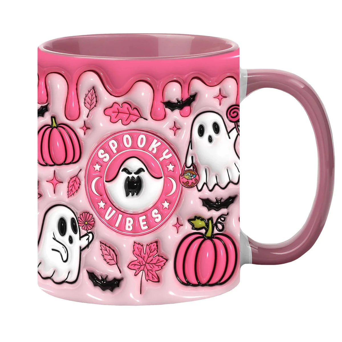 Pink Halloween mug with Spooky Vibes lettering, white ghosts, pumpkins and a pink handle against a white background.