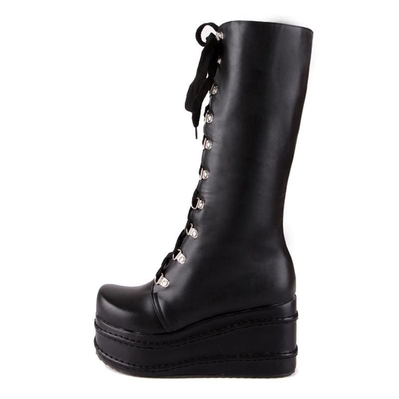 Black leather platform wedge boots with silver eyelets and thick wedge sole perfect for edgy looks