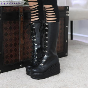 Black leather platform moto boots with lace-up silver eyelets and chunky sole perfect platform wedge boots style