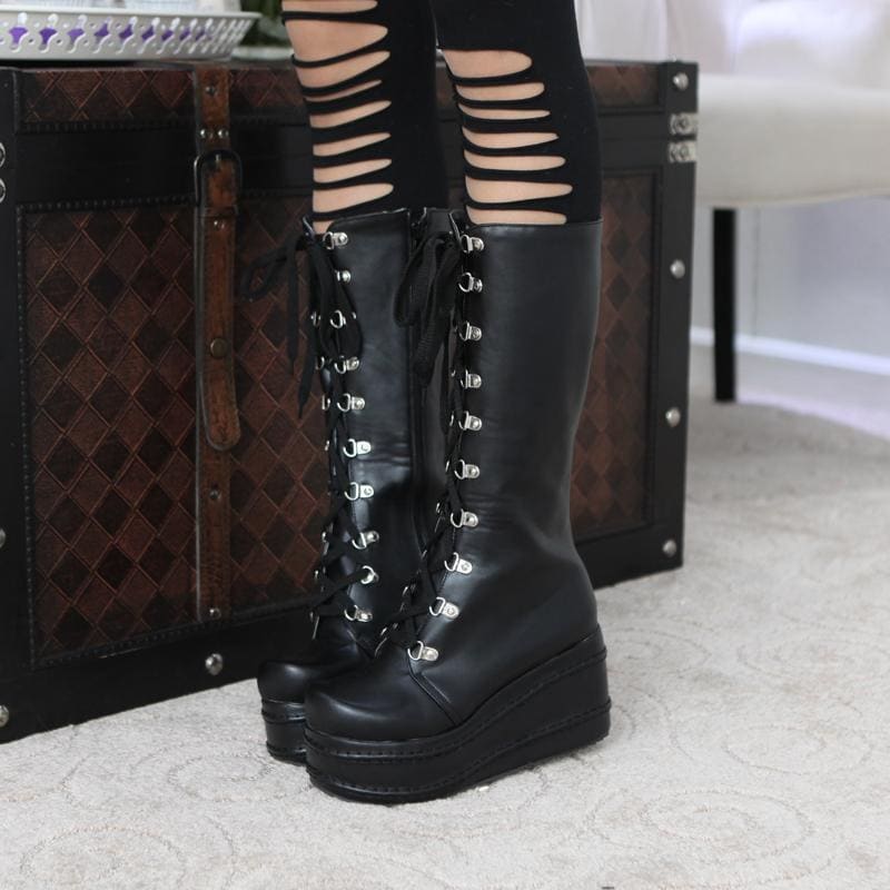 Black leather platform moto boots with lace-up silver eyelets and chunky sole perfect platform wedge boots style