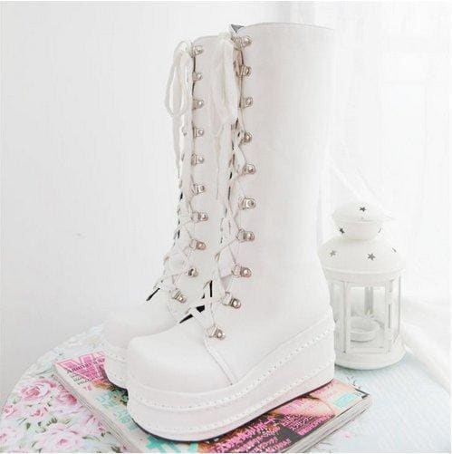 White platform moto boots with lace-up fronts and silver eyelets perfect platform wedge boots for edgy looks